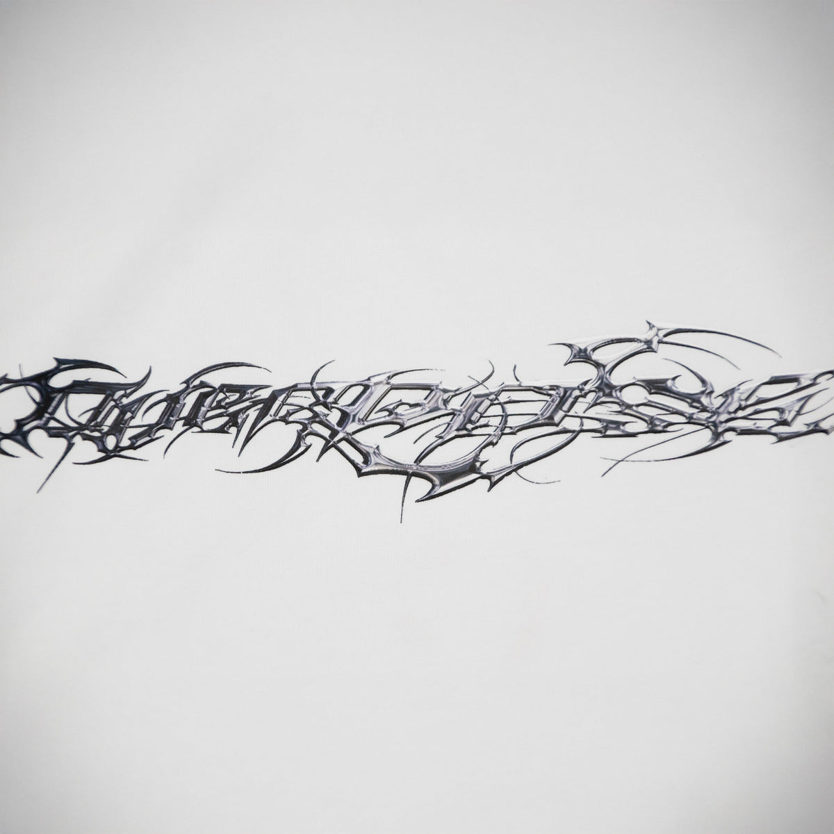 "TRIBAMETAL" LOGO TRNSFRMR L/S - ANGEL